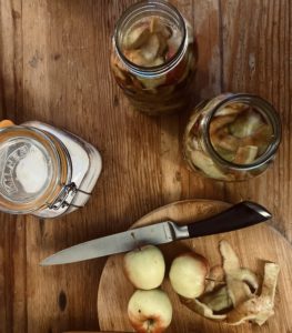 apple peelings in jars, sugar and apples